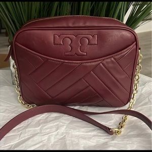 Tory Burch shoulder or crossbody burgundy purse.